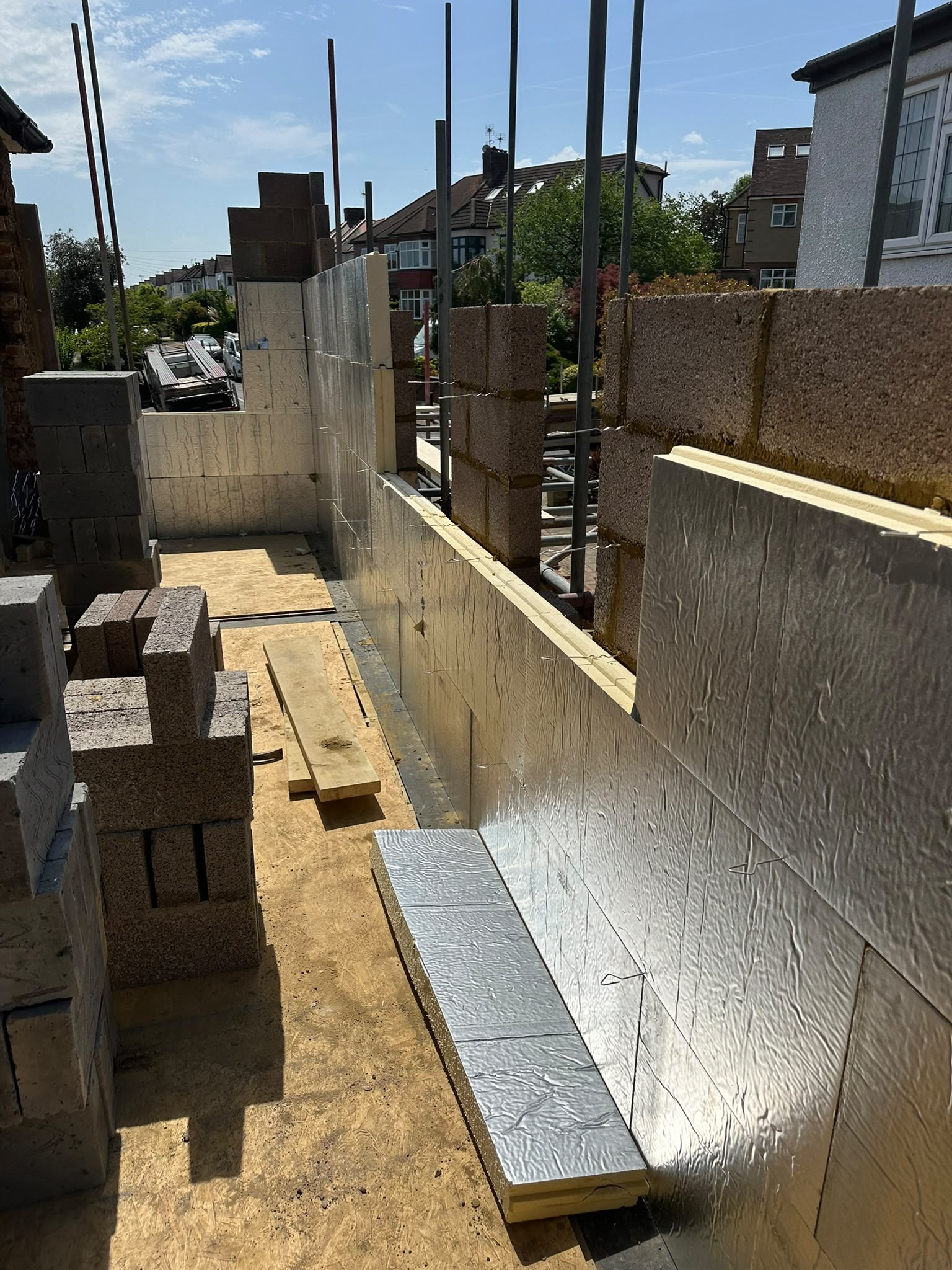Wall insulation and blockwork in progress.