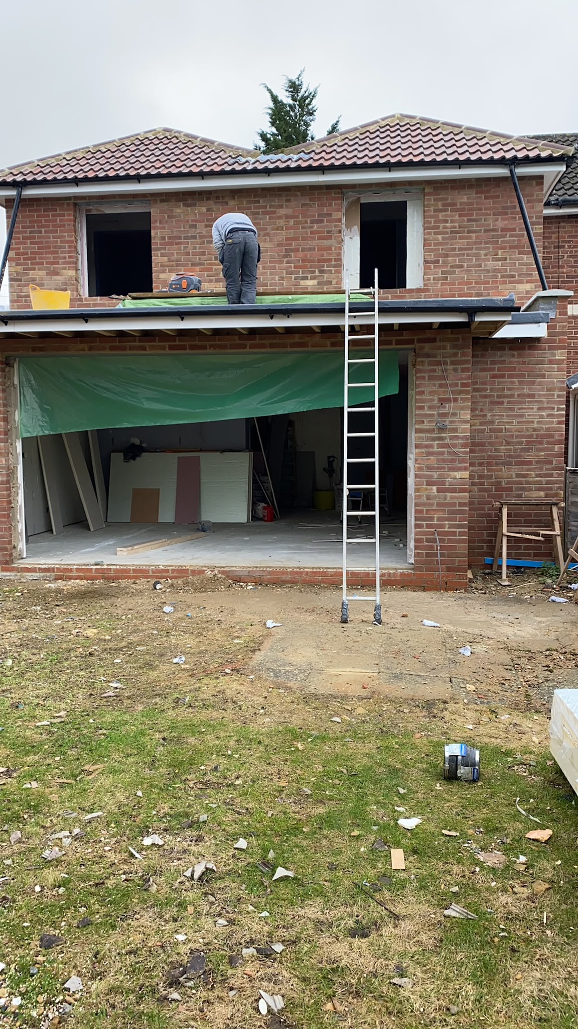 A brick-built rear extension during construction.
