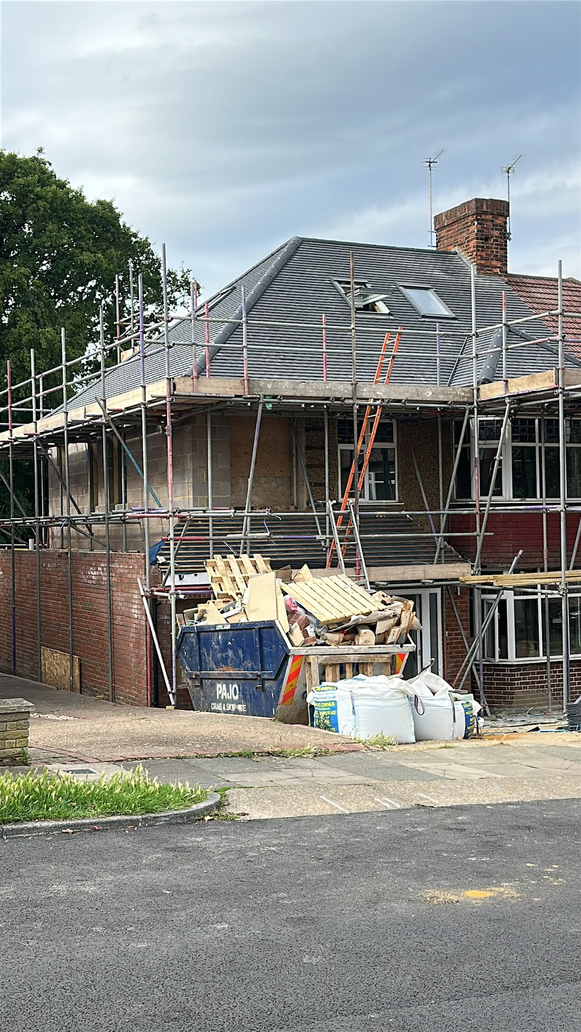 New roof tiles and rooflights during a home refurbishment.