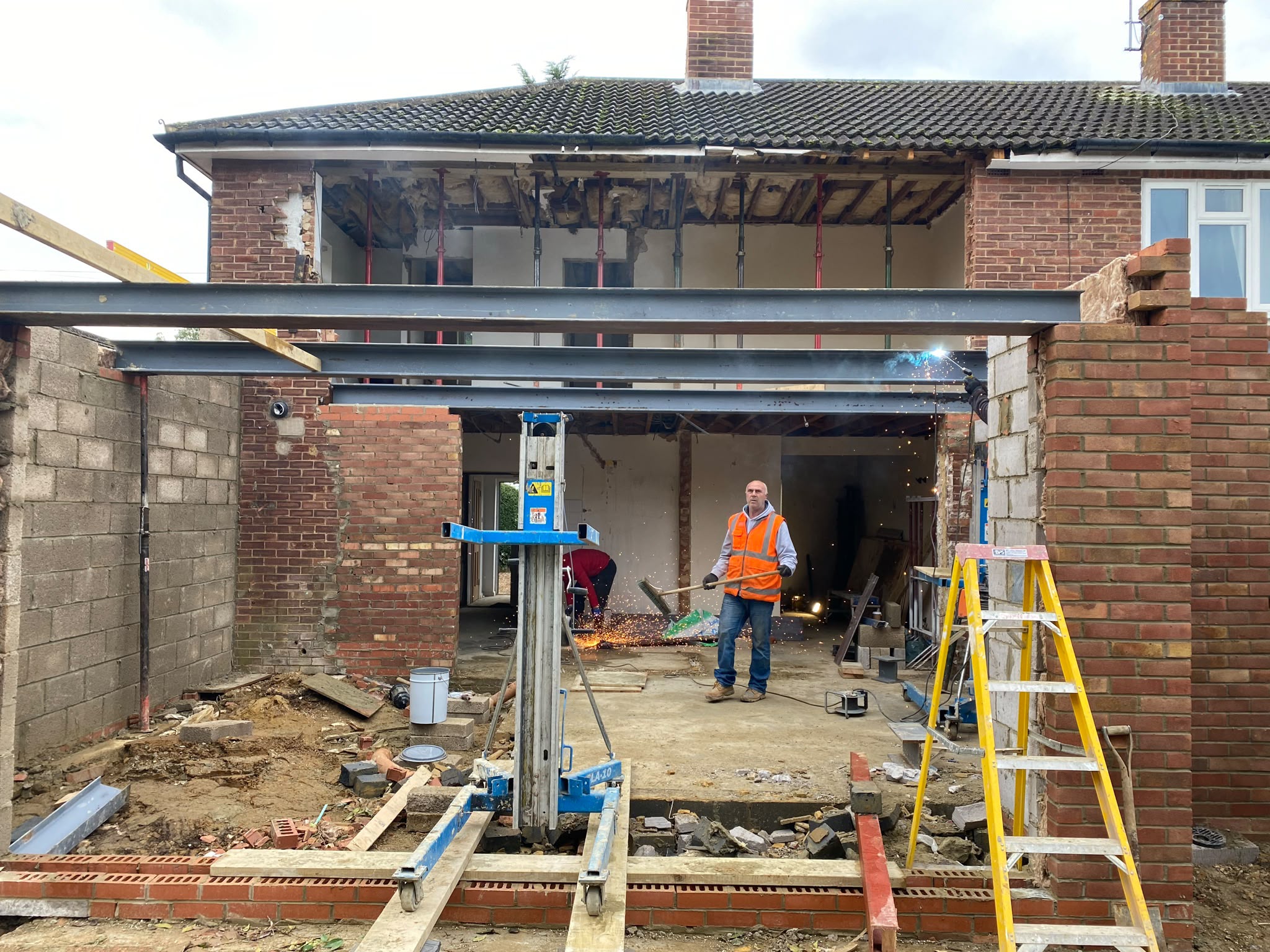 Structural steel installation for a home extension.