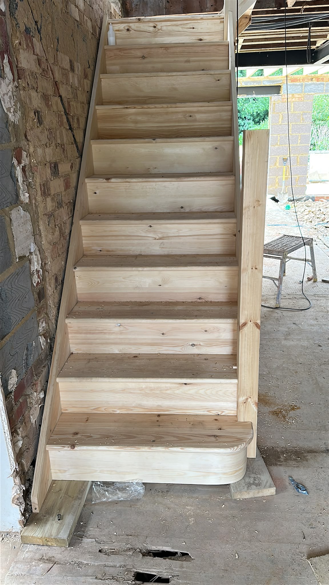 A timber staircase installed during a home renovation.